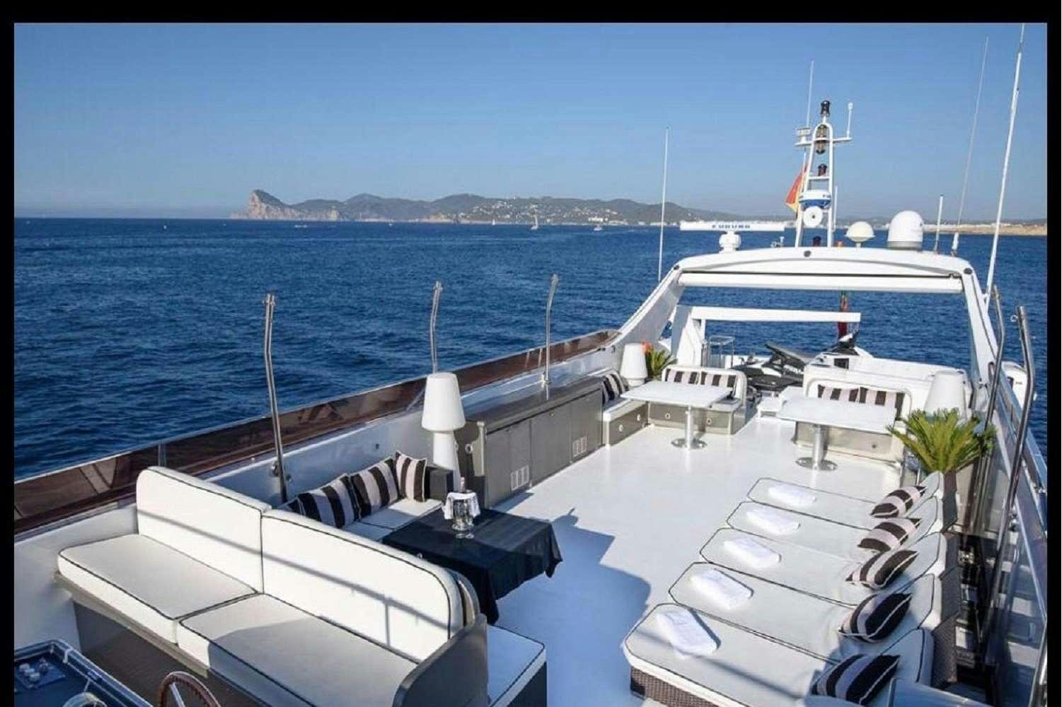 a boat docked at a pier aboard PAULA III Yacht for Charter