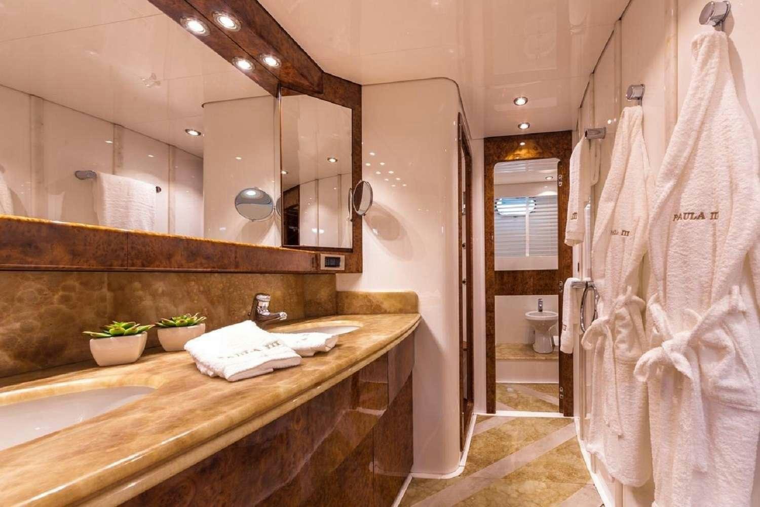 a bathroom with a large mirror aboard PAULA III Yacht for Charter