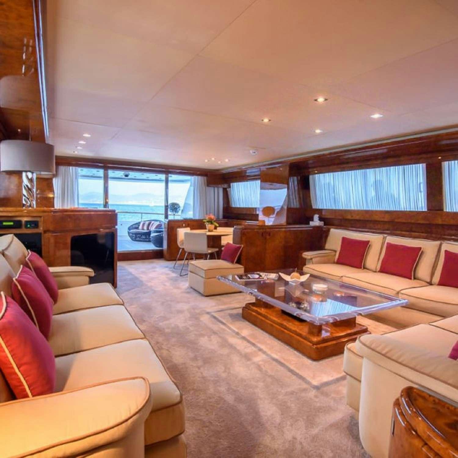a living room with a large window aboard PAULA III Yacht for Charter