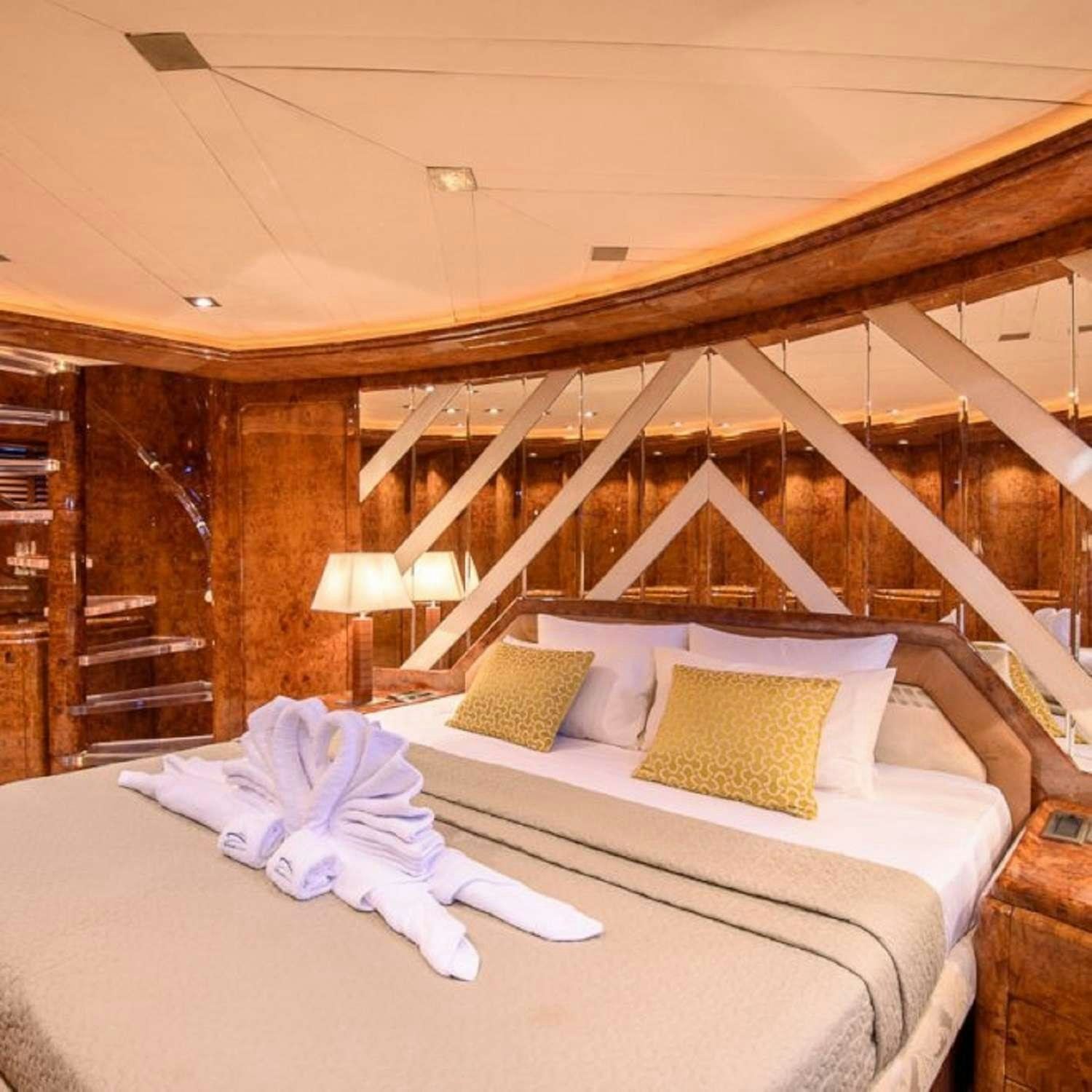 a bed with a canopy over it aboard PAULA III Yacht for Charter