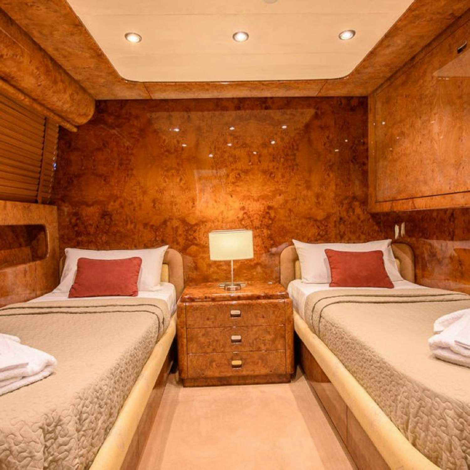 a room with two beds aboard PAULA III Yacht for Charter
