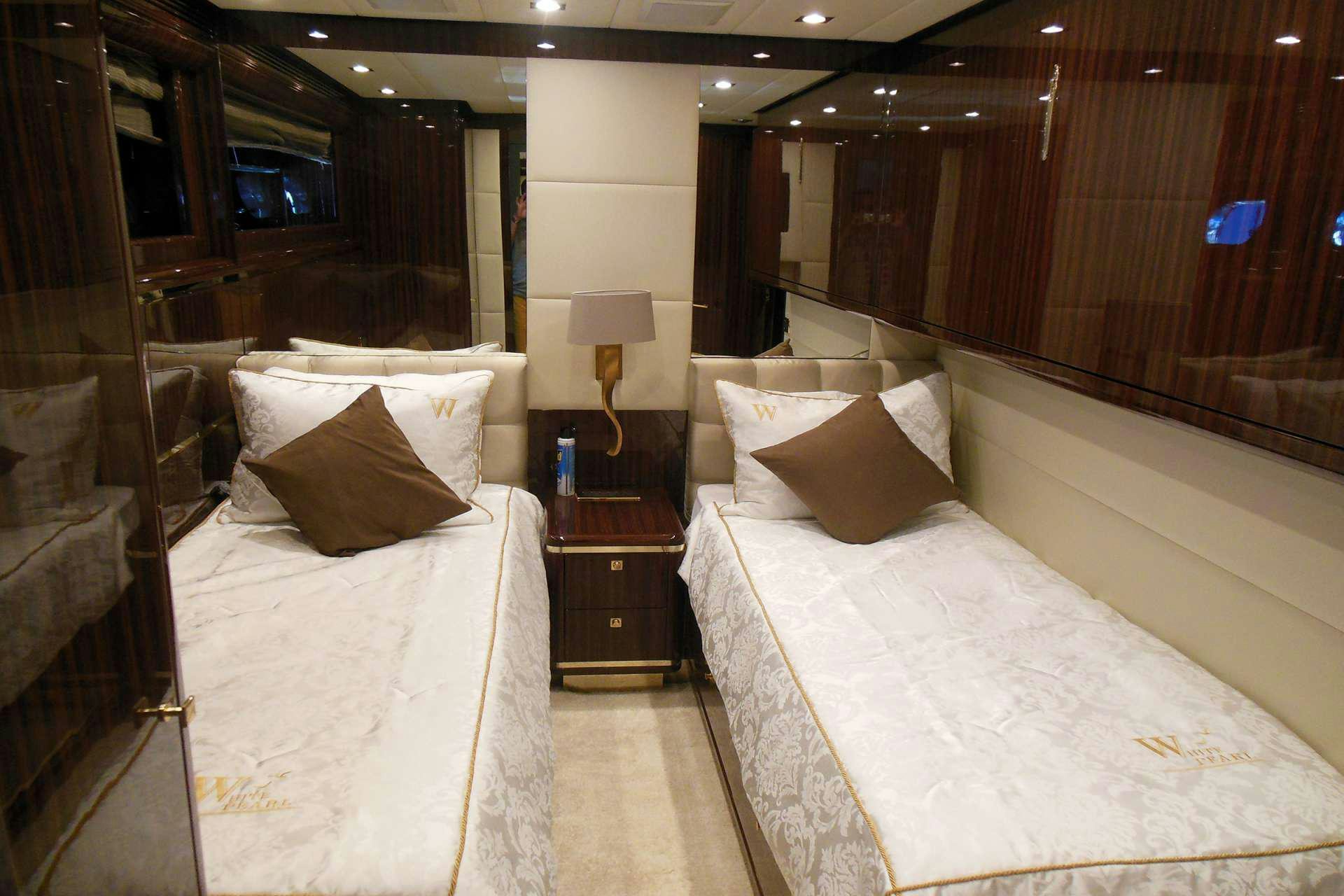 a room with two beds aboard WHITE PEARL Yacht for Charter