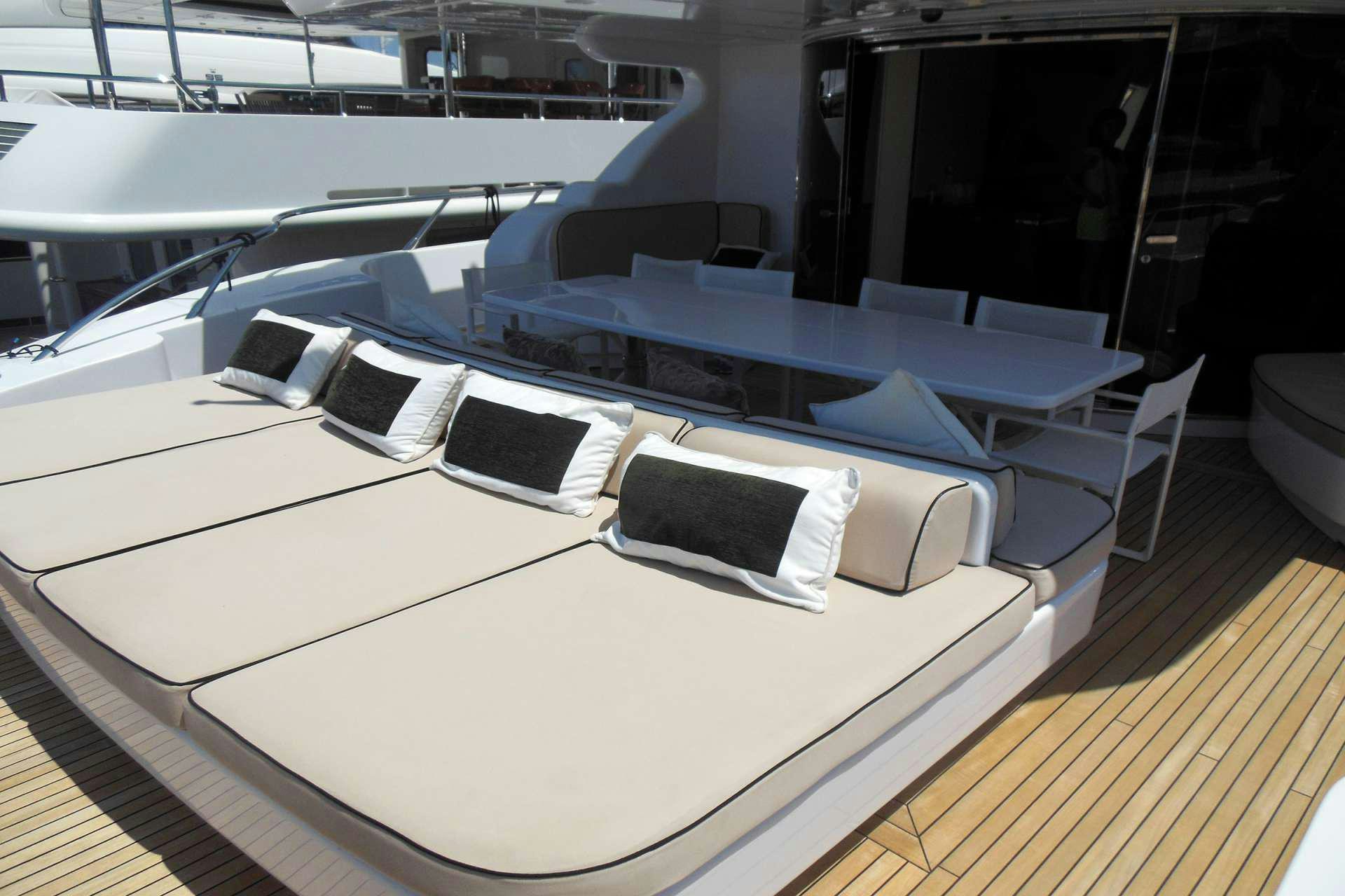 a room with a large white table and chairs aboard WHITE PEARL Yacht for Charter