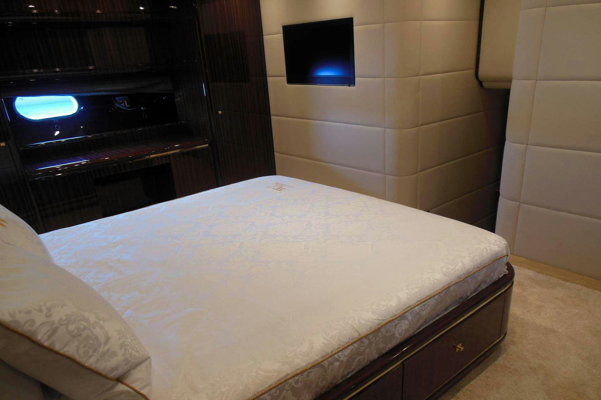 a bed with a white sheet aboard WHITE PEARL Yacht for Charter