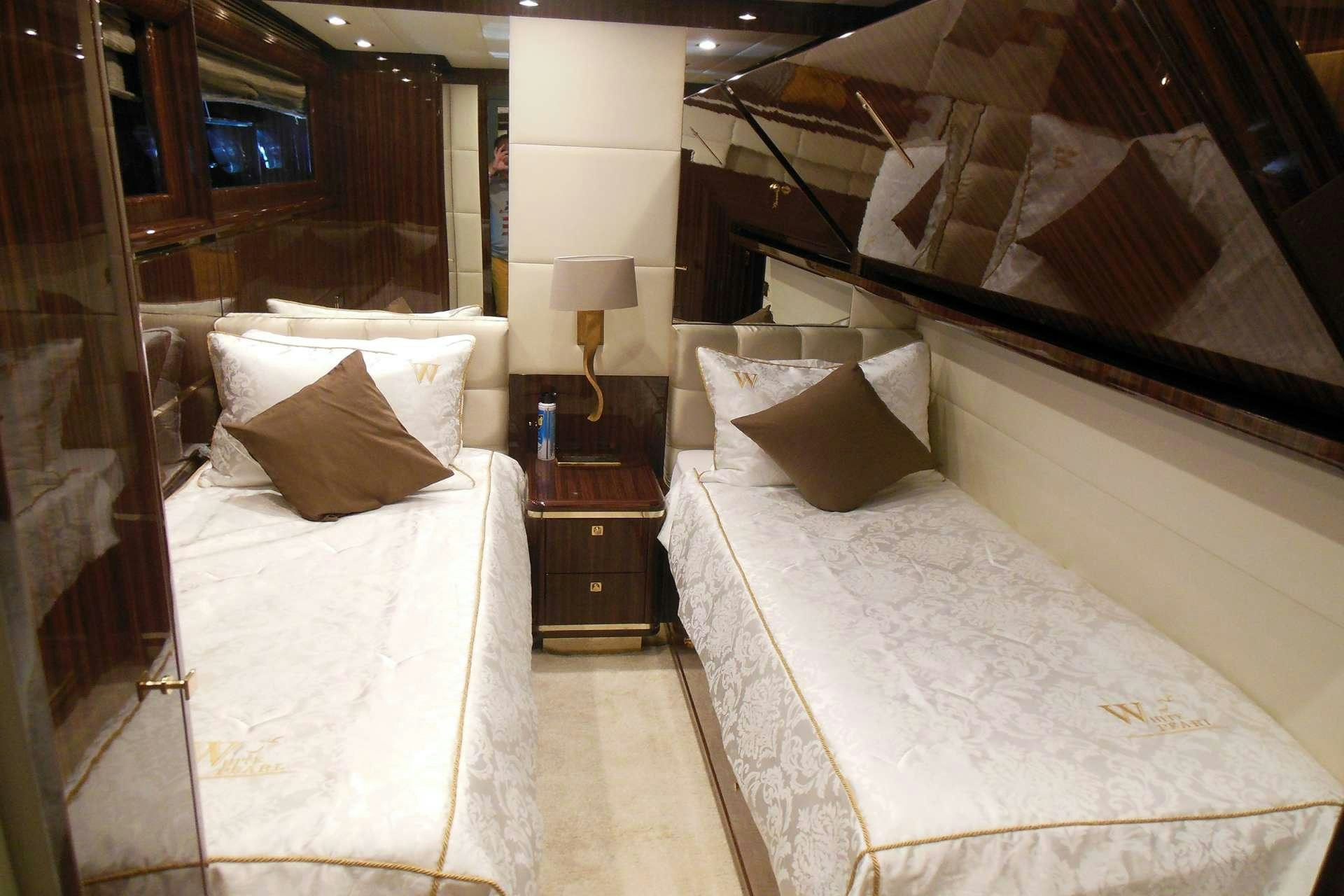 a room with two beds aboard WHITE PEARL Yacht for Charter