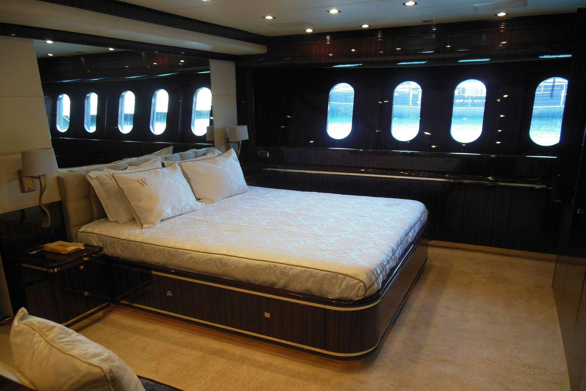 a large bed in a room aboard WHITE PEARL Yacht for Charter