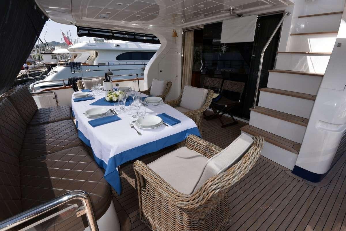 a dining table on a boat aboard ARMA VII Yacht for Charter