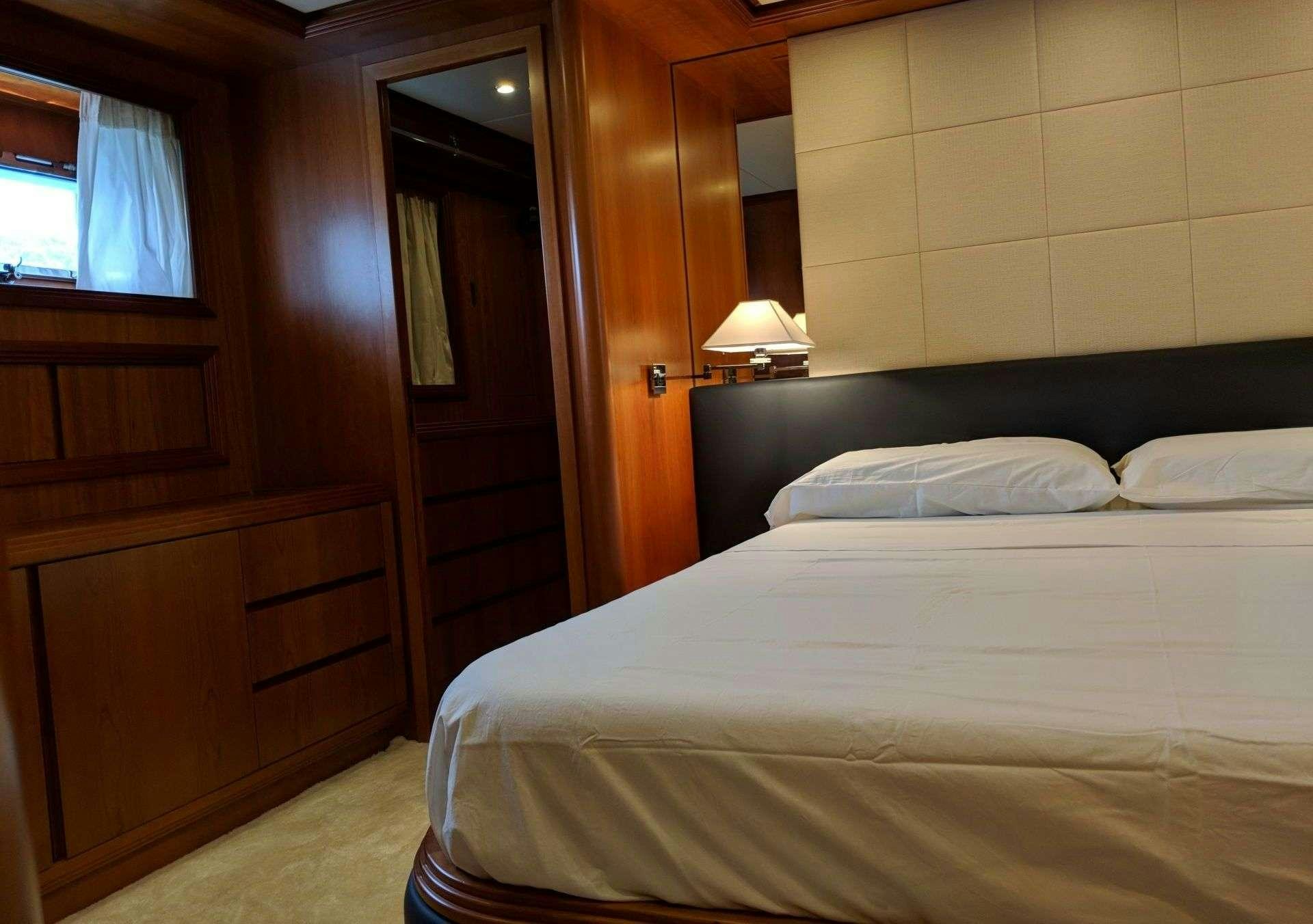 a room with two beds aboard ARMA VII Yacht for Charter