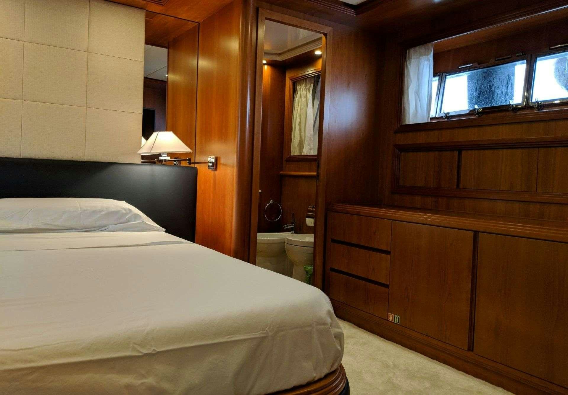 a bed in a room aboard ARMA VII Yacht for Charter
