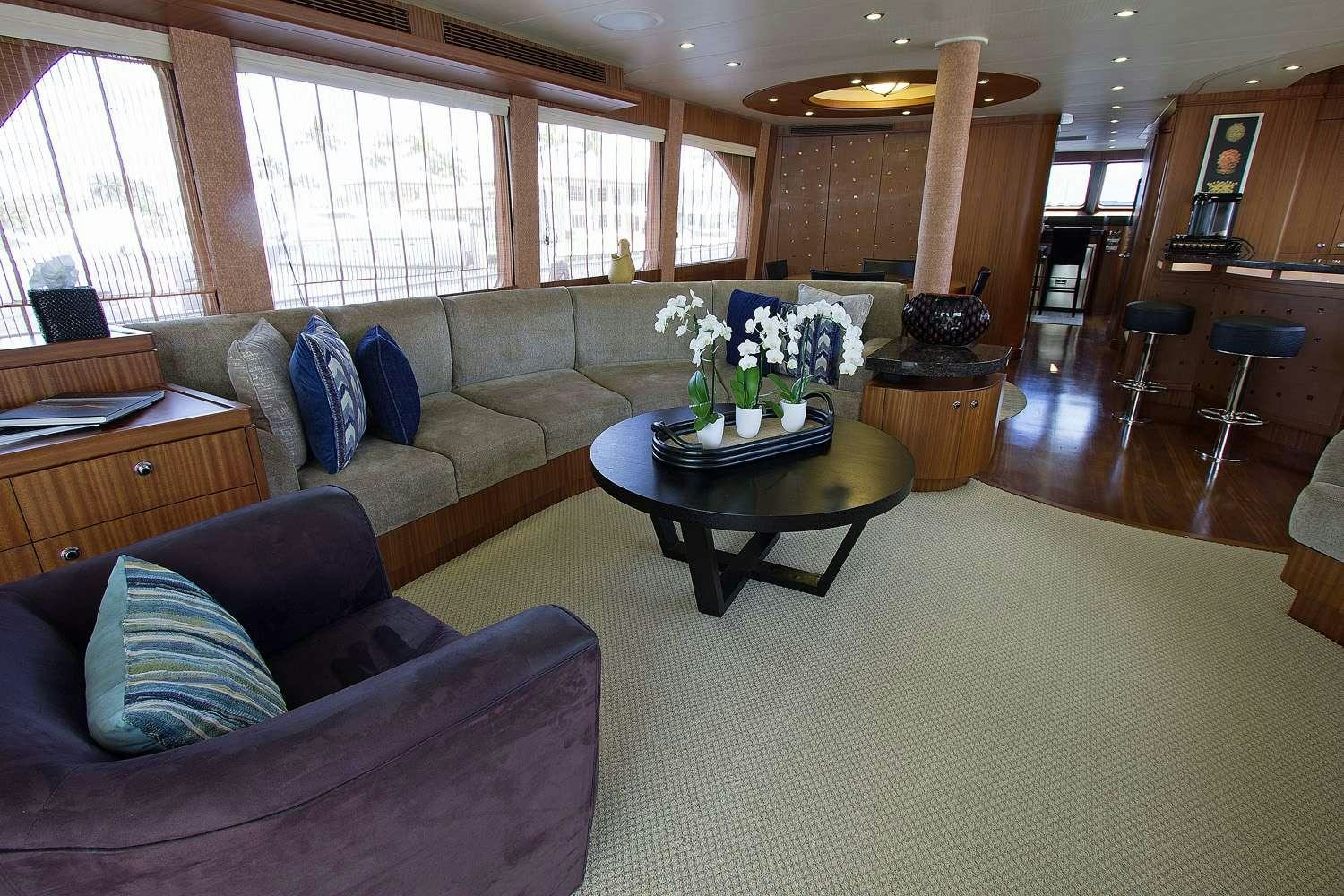 a living room with a couch and a coffee table aboard JUS CHILL'N Yacht for Charter