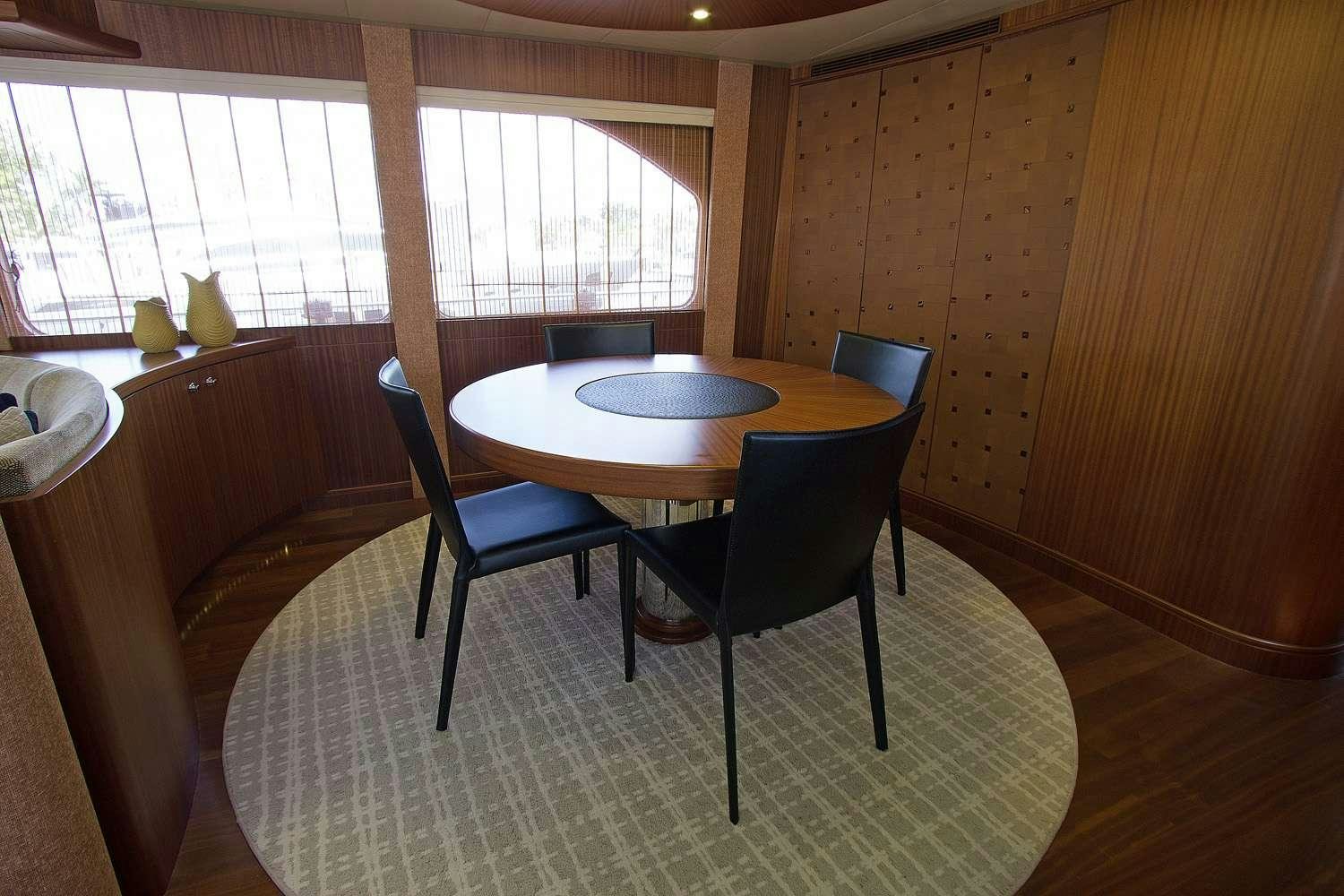 a table and chairs in a room aboard JUS CHILL'N Yacht for Charter