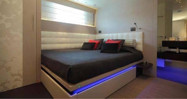 a bed in a room aboard AURORA Yacht for Charter