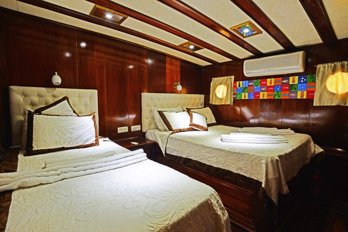 a room with two beds aboard HOLIDAY X Yacht for Charter