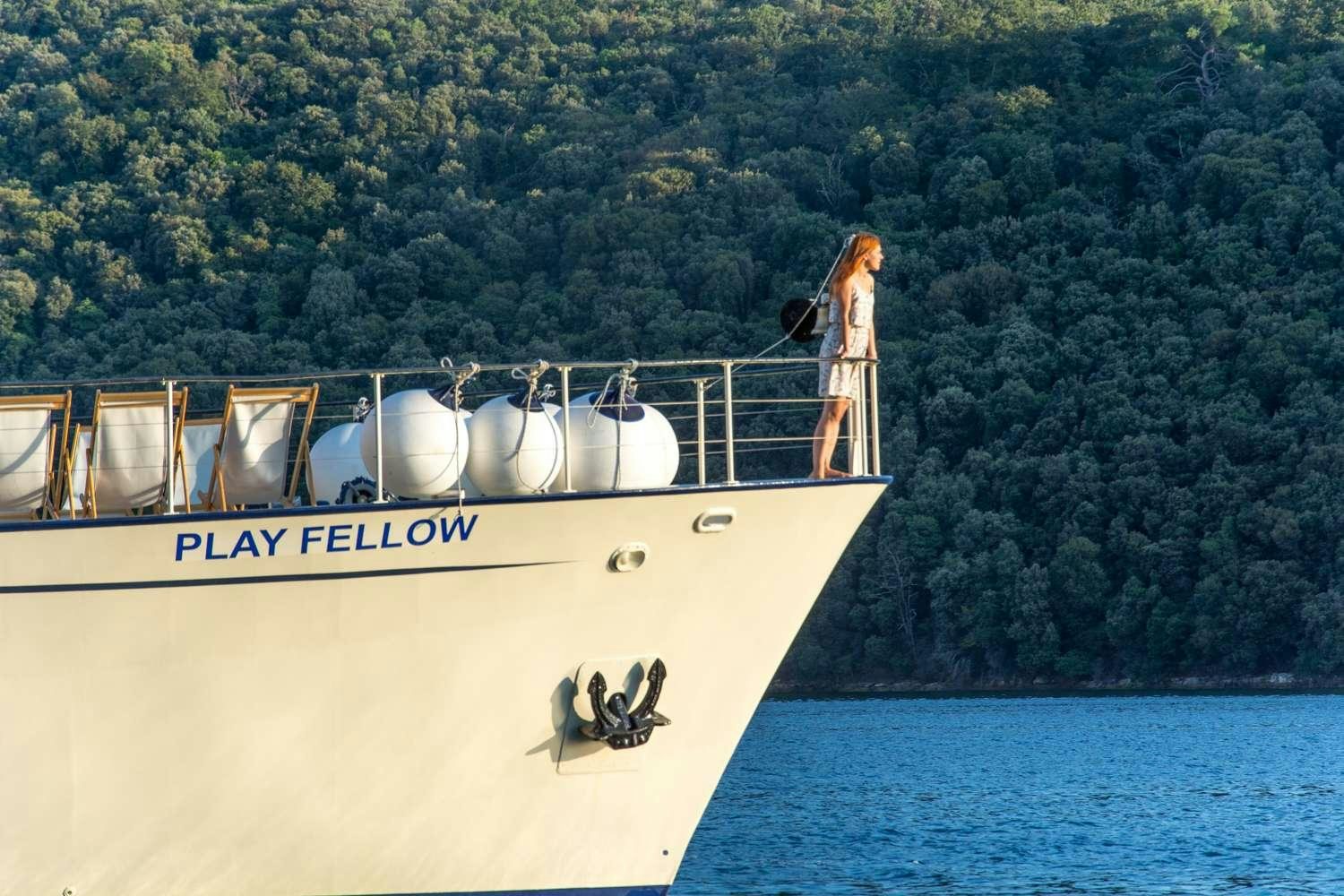 a person standing on a boat aboard Play Fellow Yacht for Charter