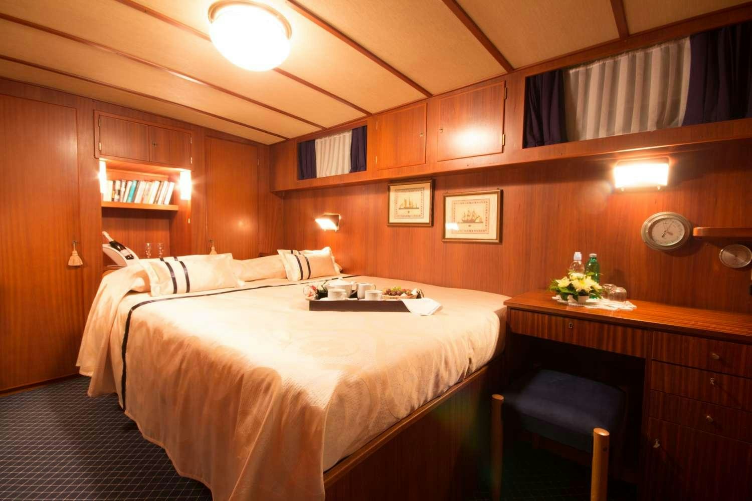 a bed in a room aboard Play Fellow Yacht for Charter