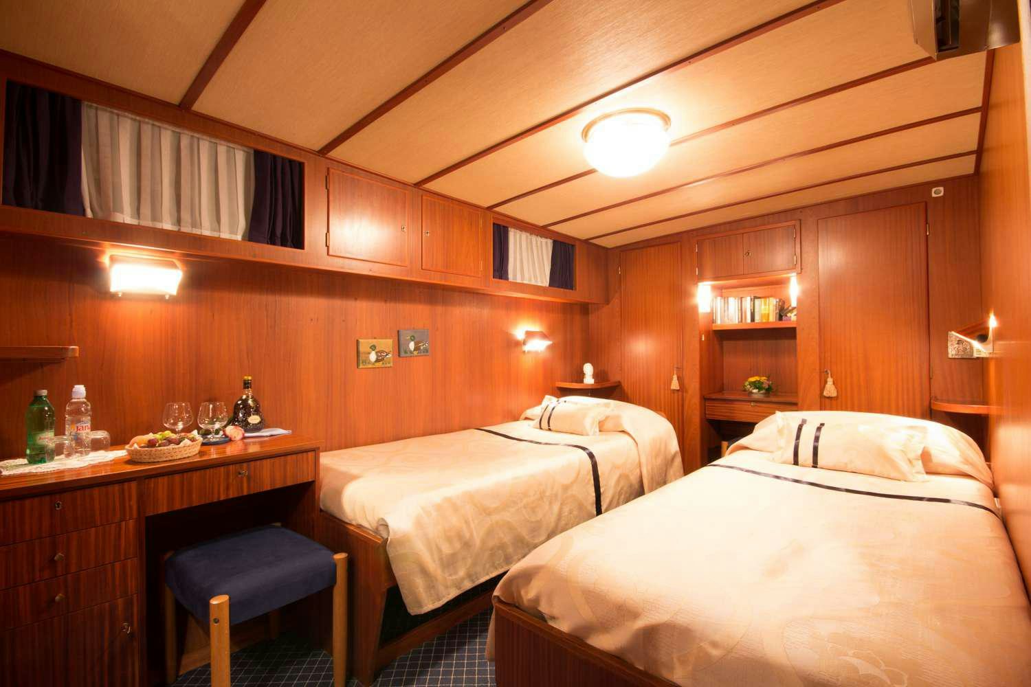 a couple of beds in a room aboard Play Fellow Yacht for Charter