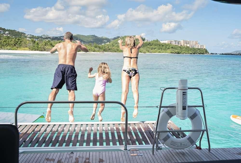 a group of people jumping into a pool aboard ISLAND HOPPIN' Yacht for Charter