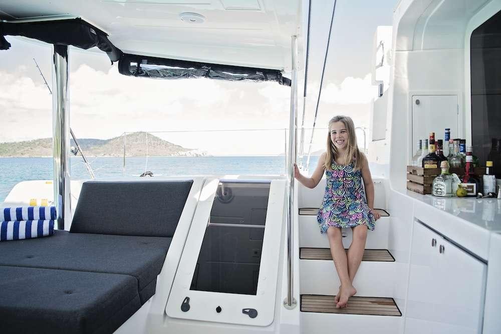 a woman sitting on a boat aboard ISLAND HOPPIN' Yacht for Charter