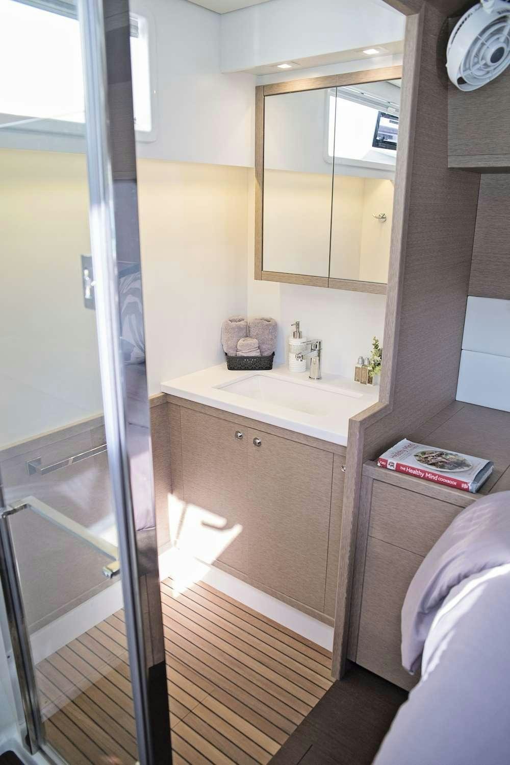 a bathroom with a shower unit aboard ISLAND HOPPIN' Yacht for Charter