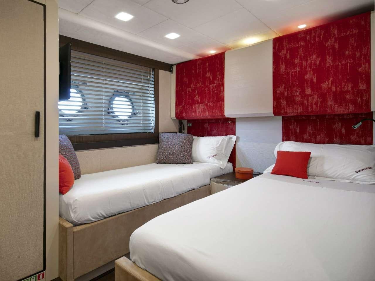 a room with two beds aboard ESMERALDA OF THE SEAS Yacht for Charter