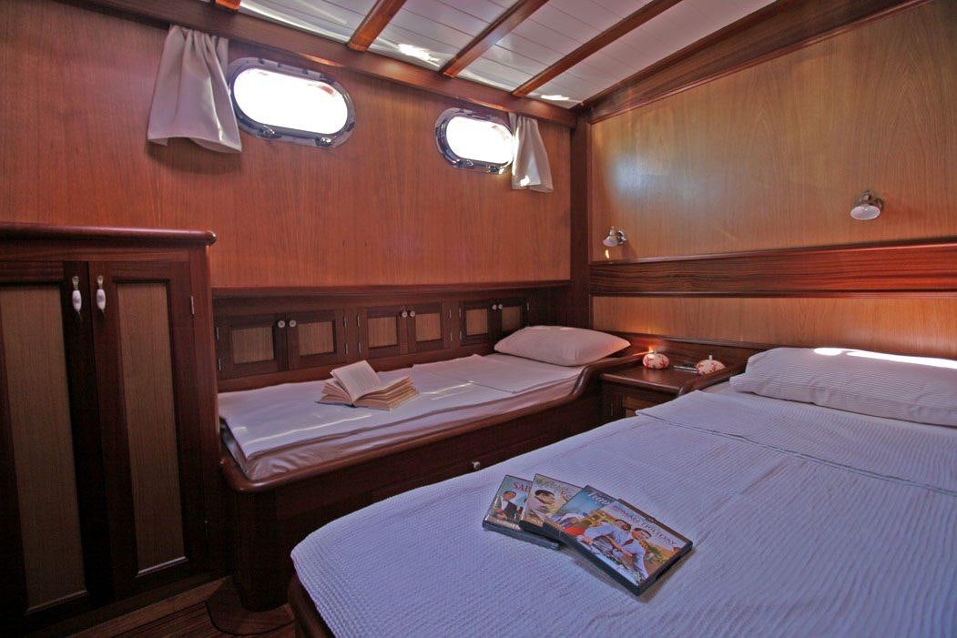 a couple of beds in a room aboard HAYAL 62 Yacht for Charter