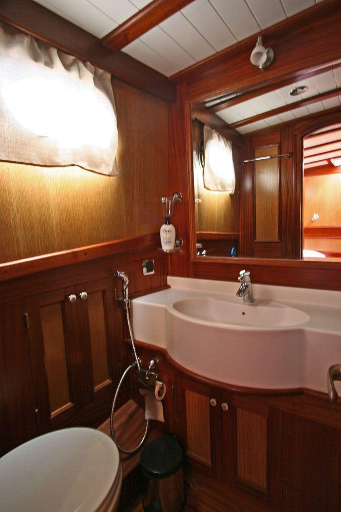 a bathroom with a sink and a mirror aboard HAYAL 62 Yacht for Charter