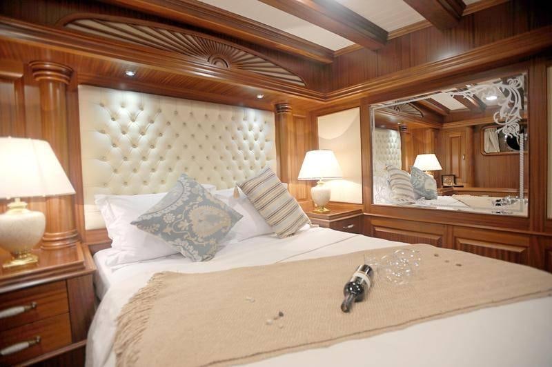 a large bed with a large mirror above it aboard MARE NOSTRUM Yacht for Charter