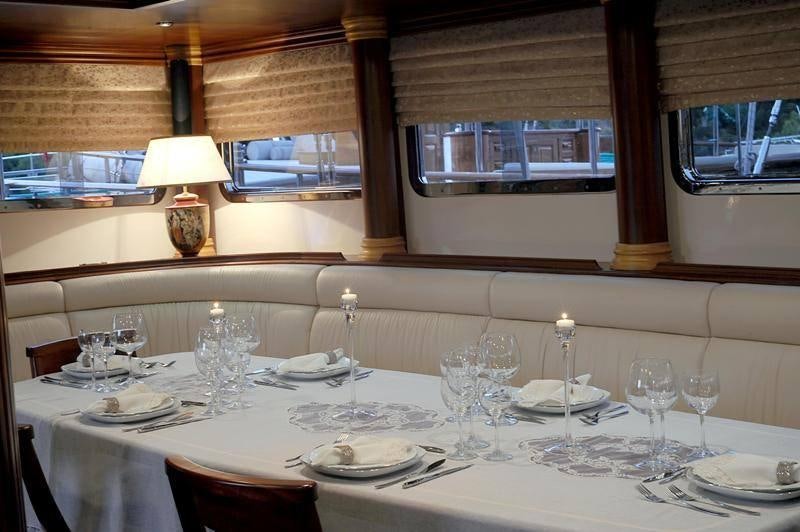 a table set for a dinner aboard MARE NOSTRUM Yacht for Charter