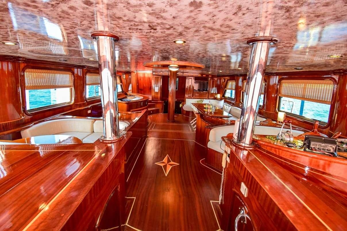 inside of a building with a large chandelier and a large mirror aboard S DOGU Yacht for Charter