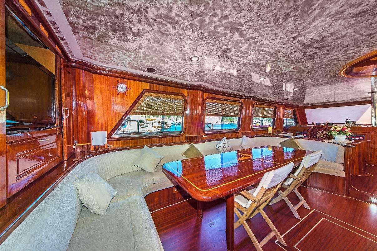 a living room with a couch and a table aboard S DOGU Yacht for Charter