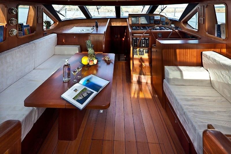 a room with a couch and a table aboard MYOSOTIS Yacht for Charter