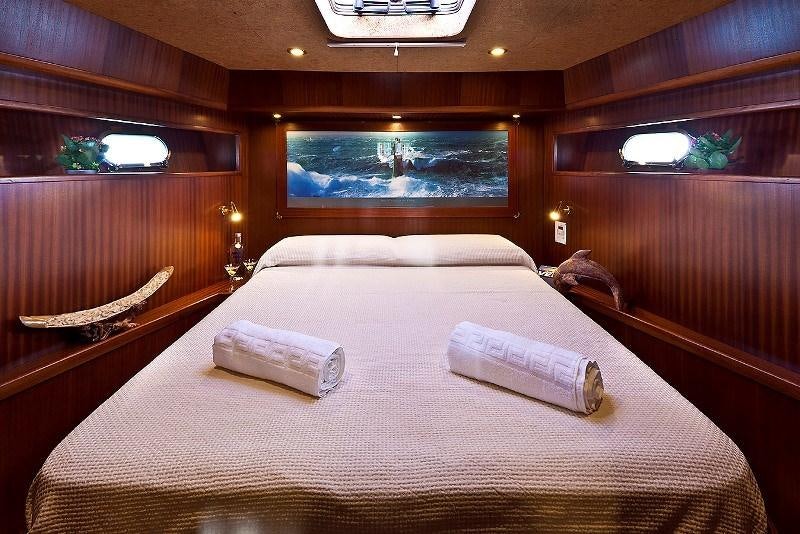 a bed in a cabin aboard MYOSOTIS Yacht for Charter