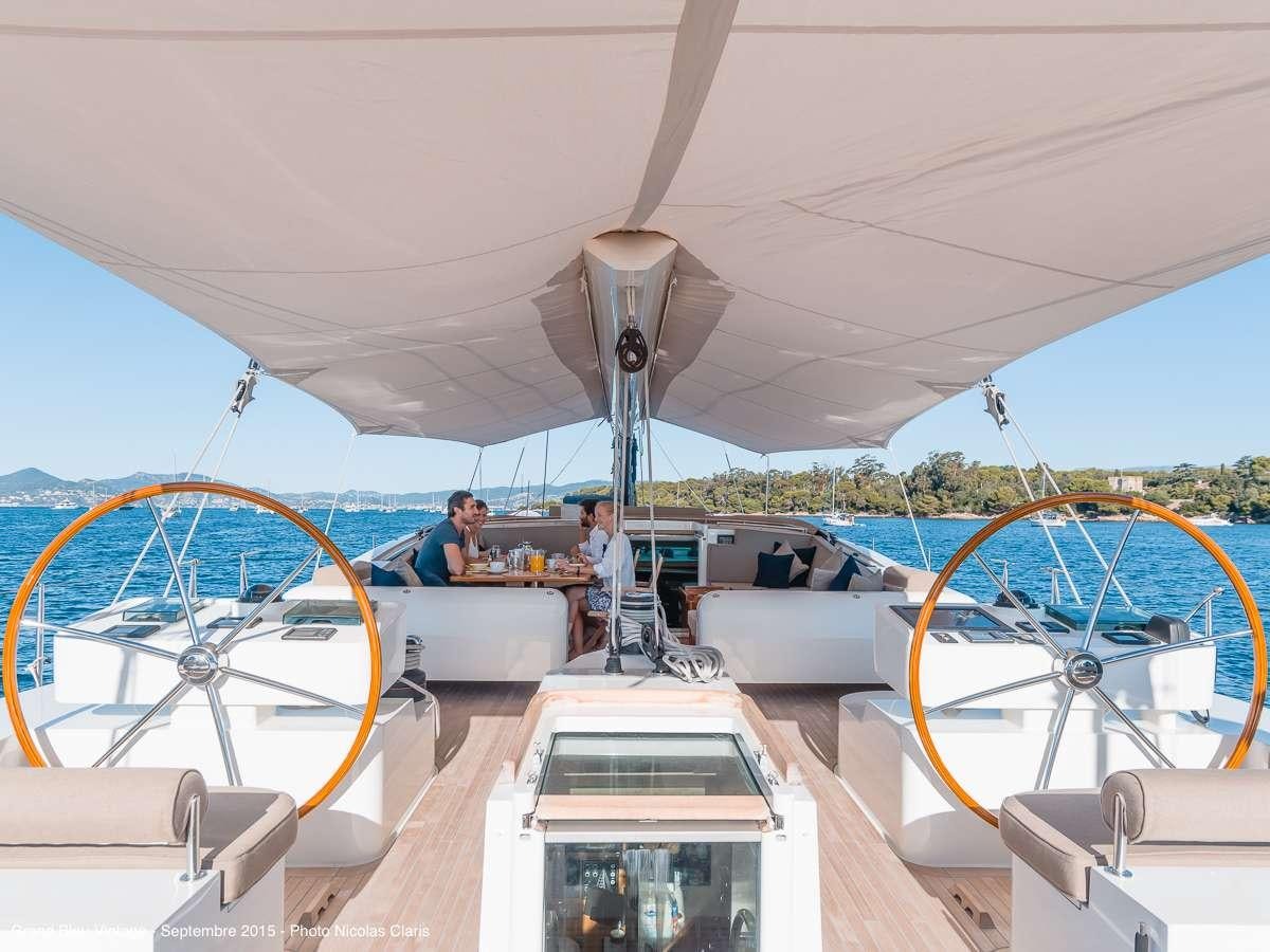 a group of people on a boat aboard GRAND BLEU VINTAGE Yacht for Charter