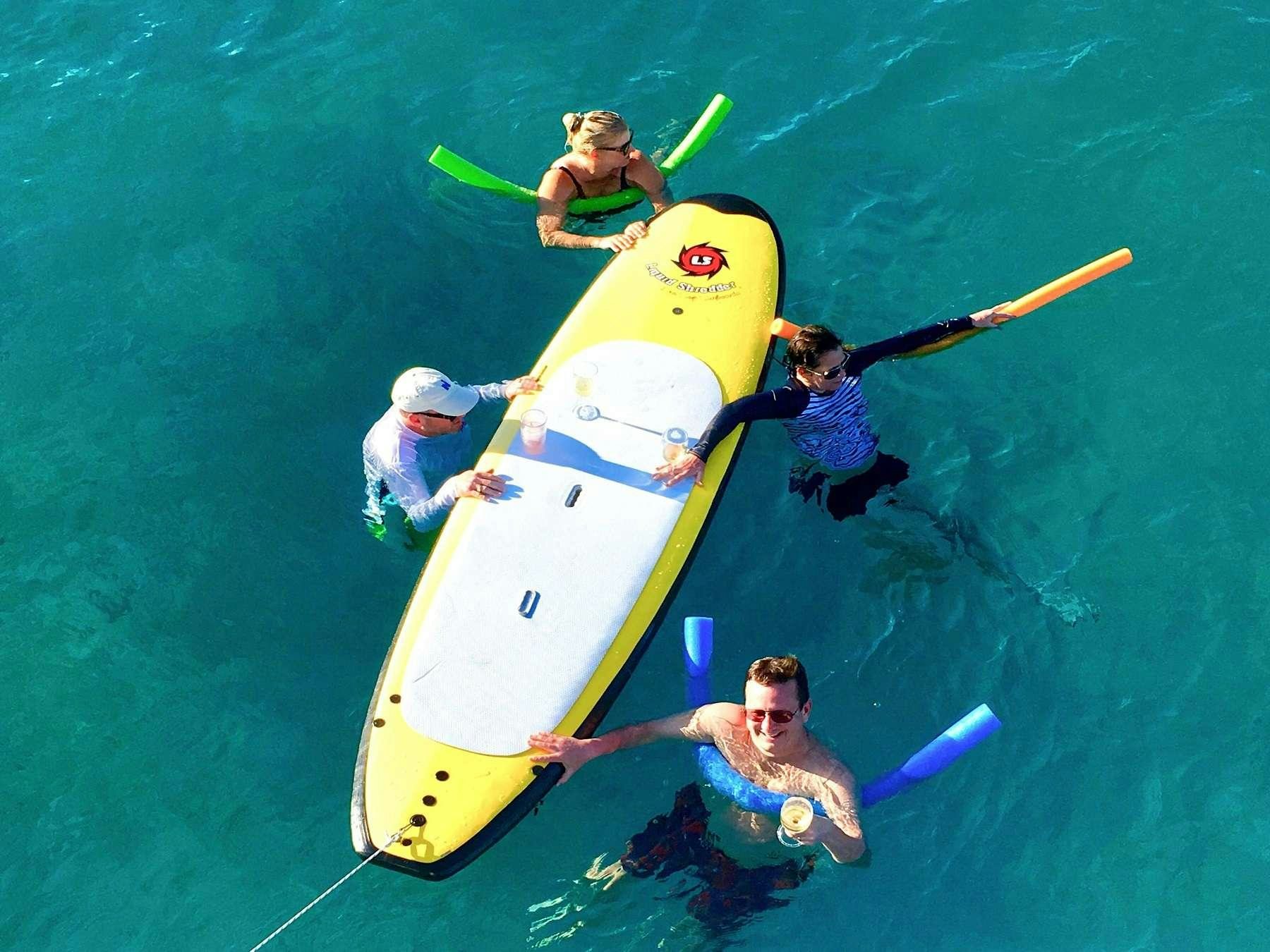 a group of people in a kayak aboard MCGREGOR III Yacht for Charter