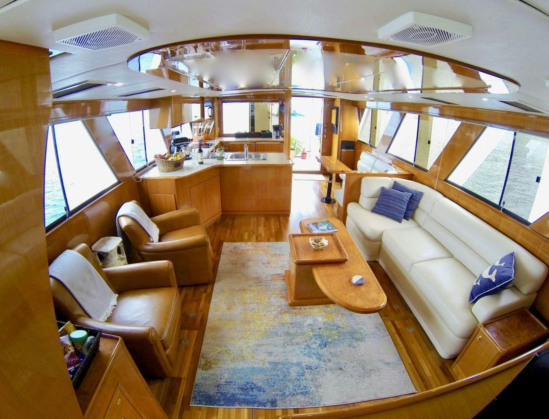 a large living room with a large window aboard MCGREGOR III Yacht for Charter