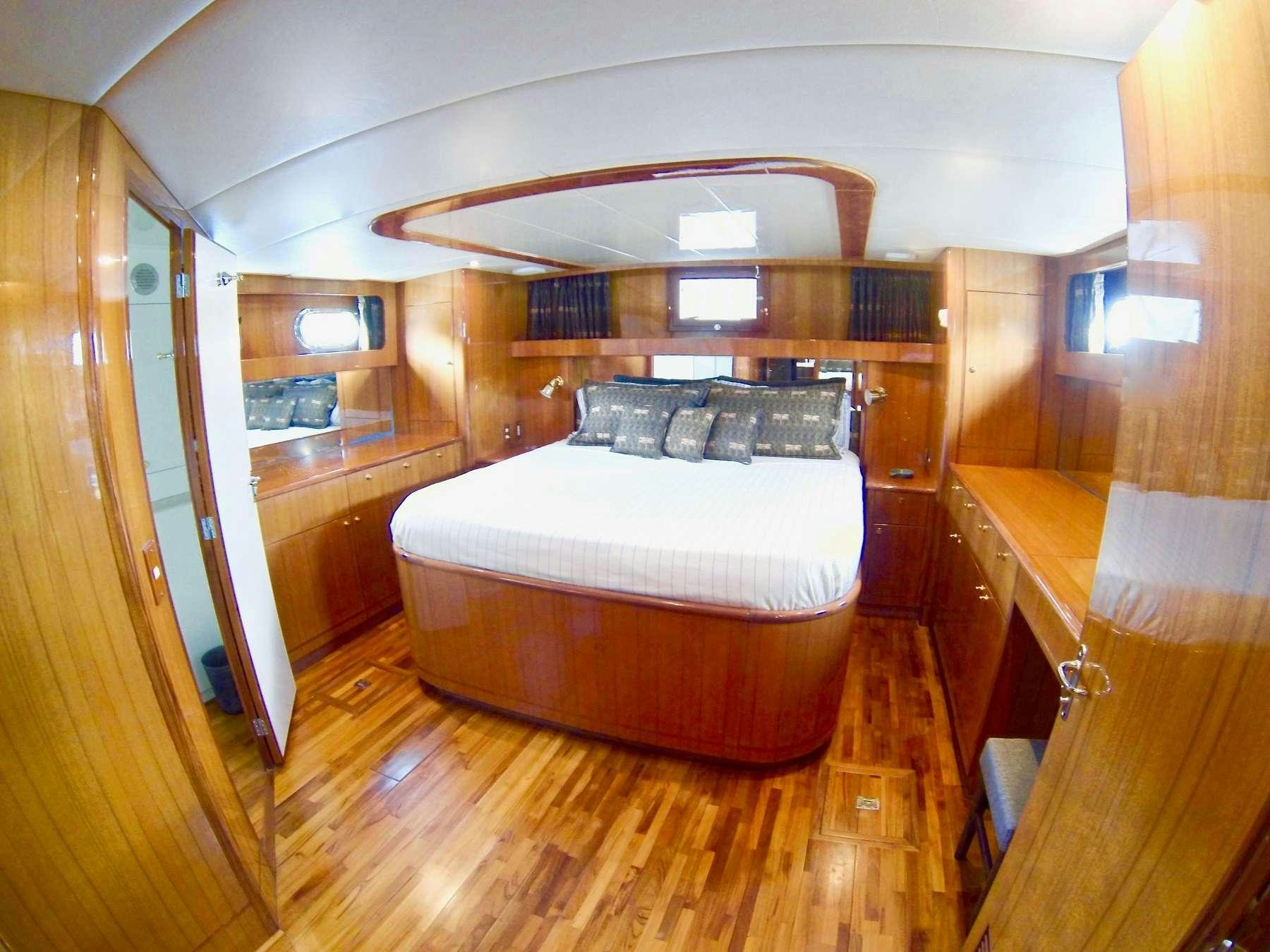 a bedroom with a bed aboard MCGREGOR III Yacht for Charter