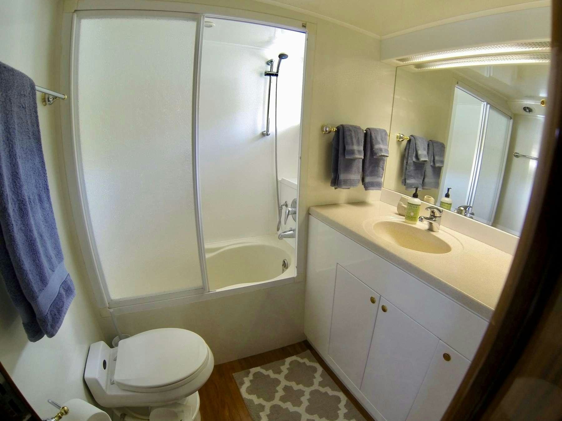 a bathroom with a toilet and sink aboard MCGREGOR III Yacht for Charter