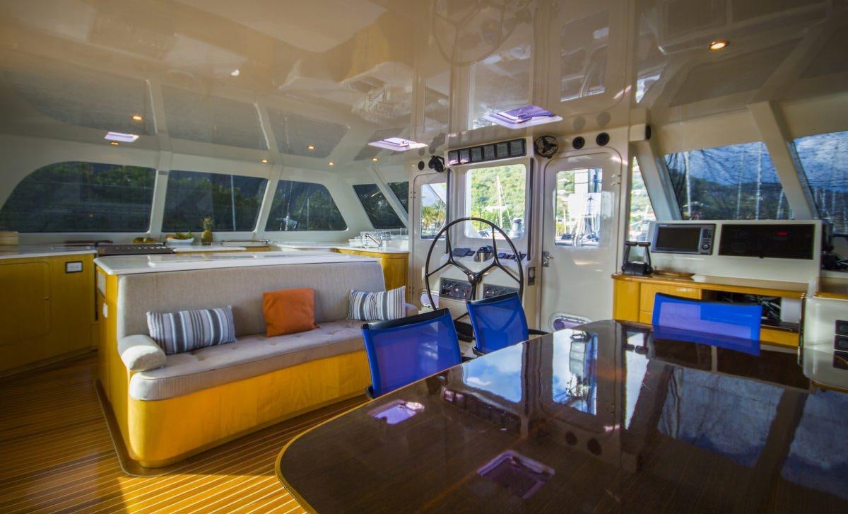 a room with a couch and a table aboard ZENYATTA Yacht for Charter