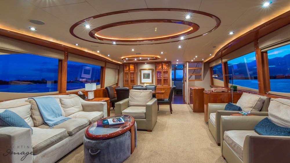 a living room with a large window aboard CHIP Yacht for Charter