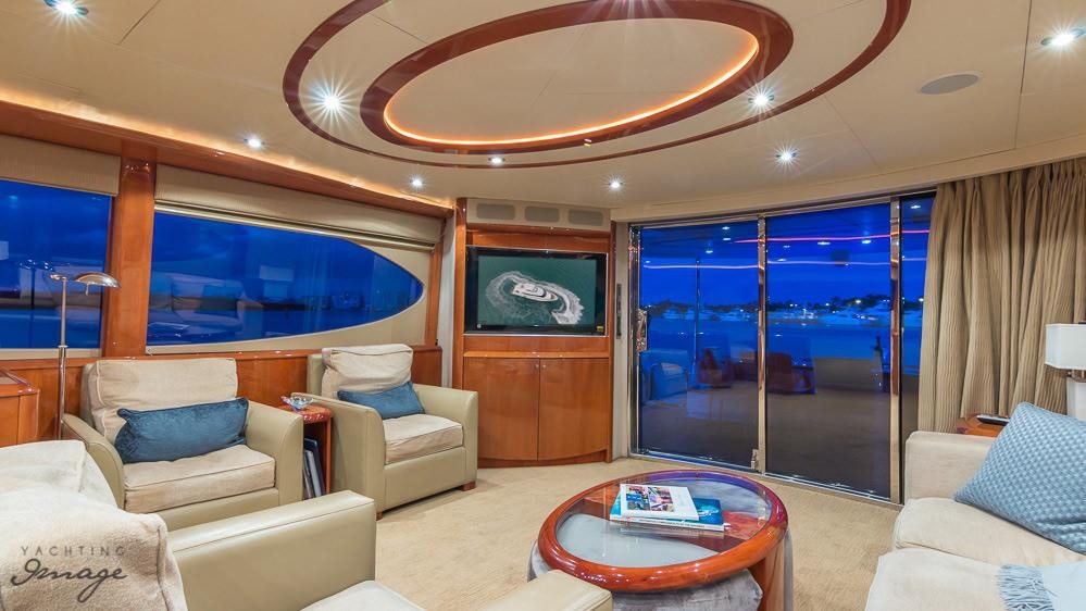 a living room with a large window aboard CHIP Yacht for Charter