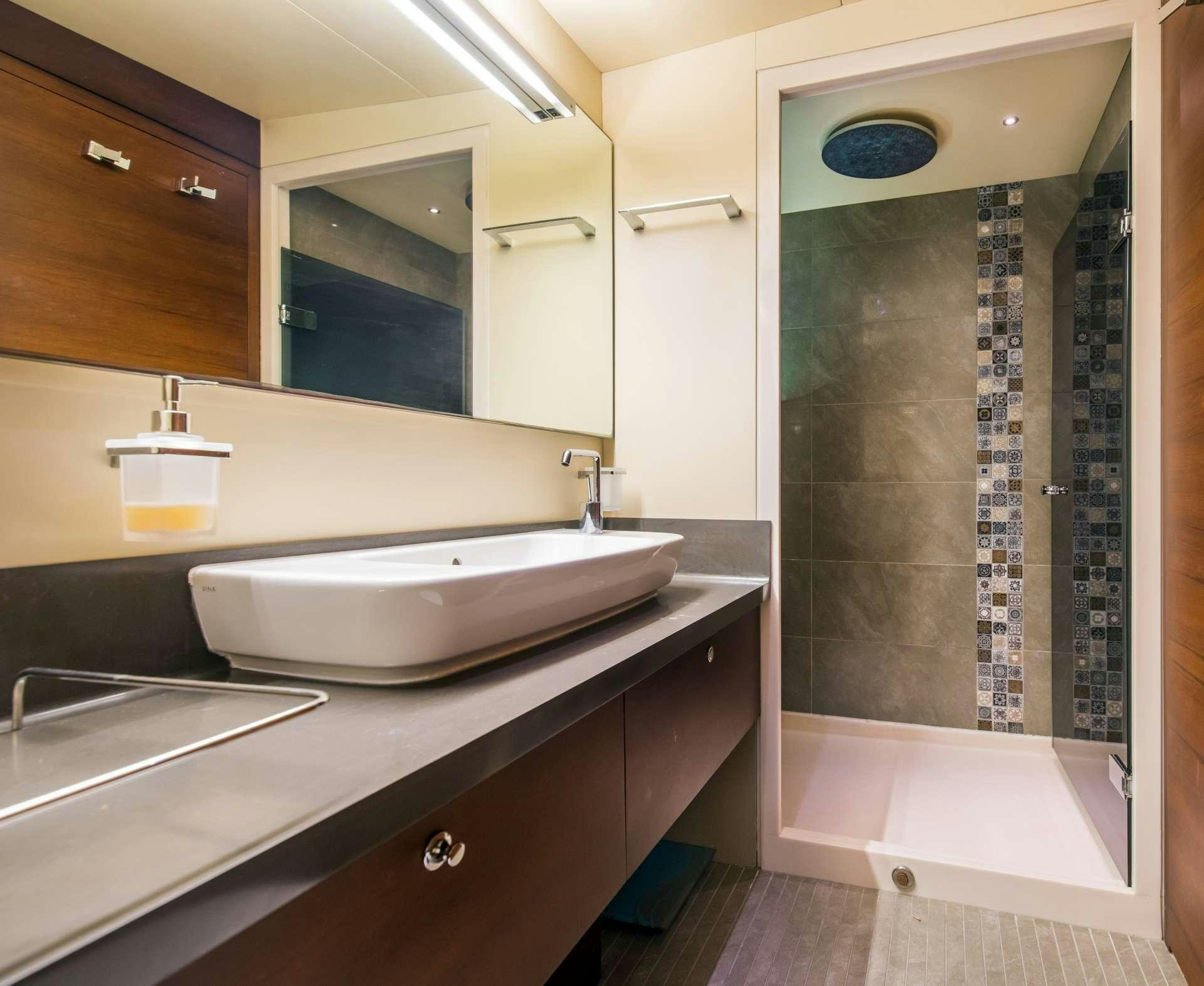 a bathroom with sinks and mirrors aboard MEIRA Yacht for Charter