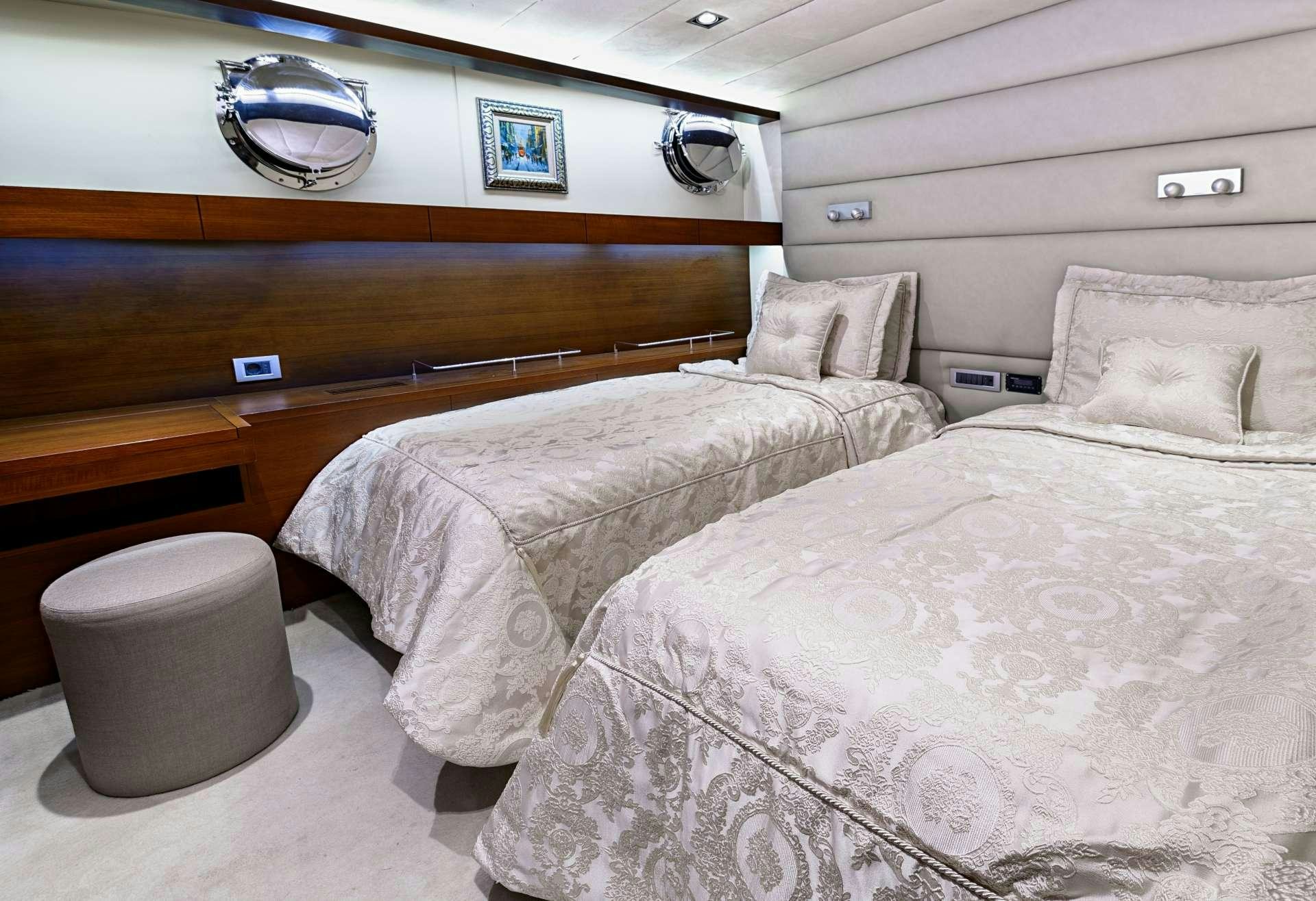 a couple of beds in a room aboard MEIRA Yacht for Charter