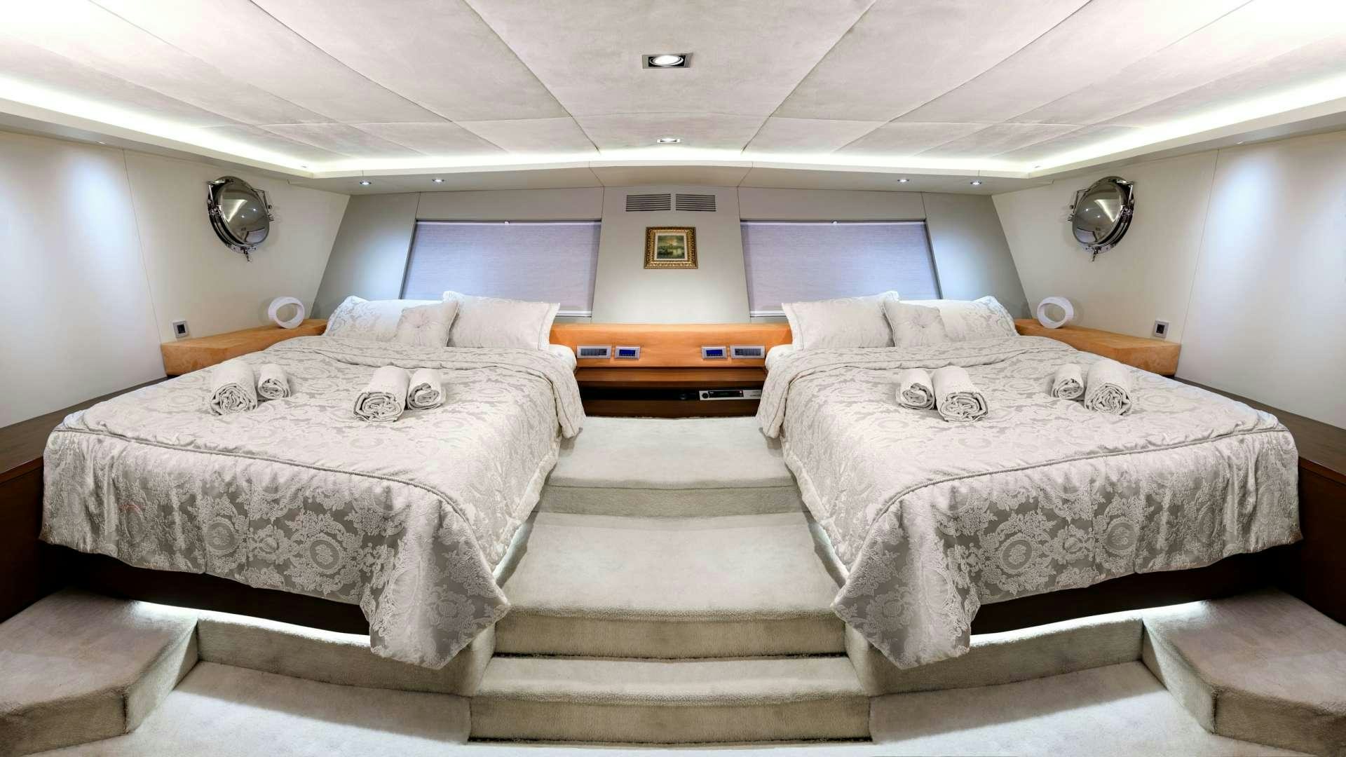 a room with two beds aboard MEIRA Yacht for Charter