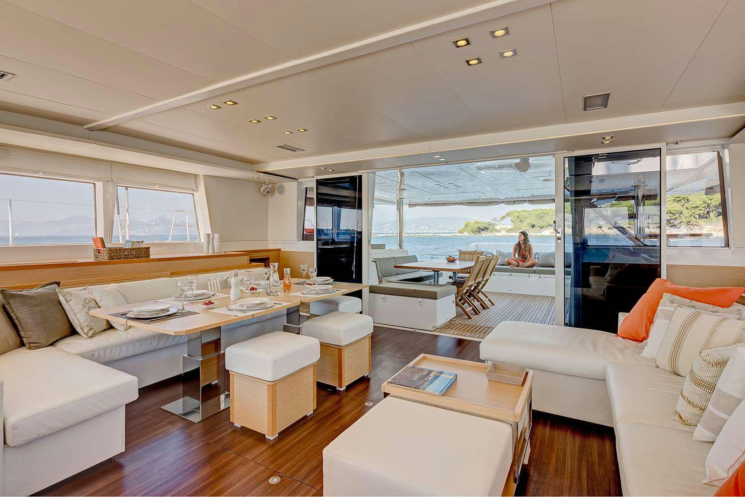 a living room with a large window aboard GB ODYSSEY Yacht for Charter