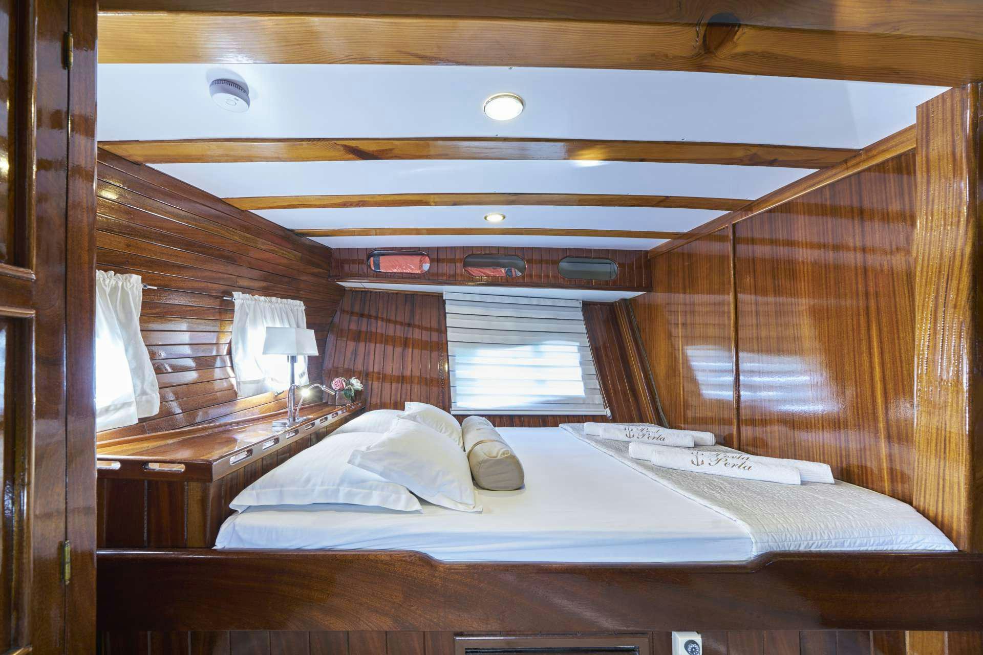 a room with two beds aboard PERLA Yacht for Charter