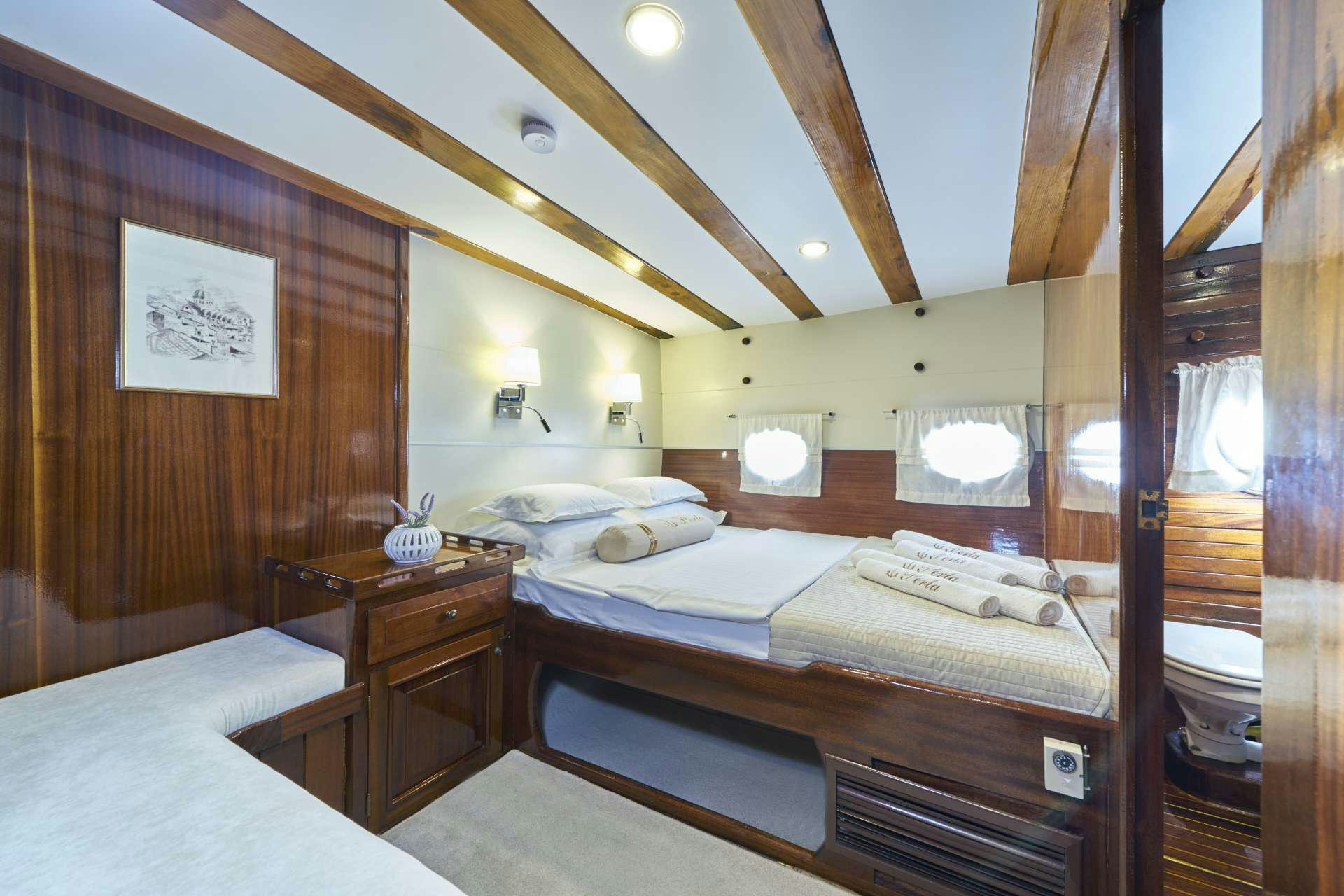 a room with two beds aboard PERLA Yacht for Charter