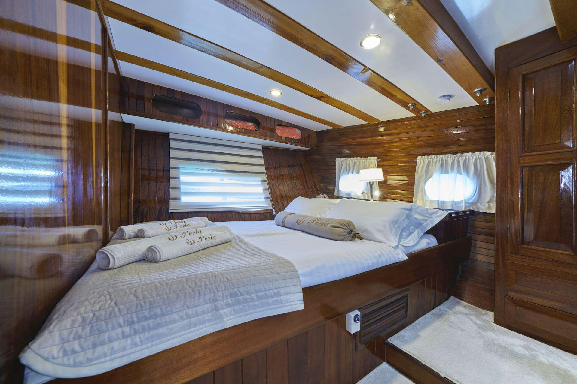 a bed in a cabin aboard PERLA Yacht for Charter