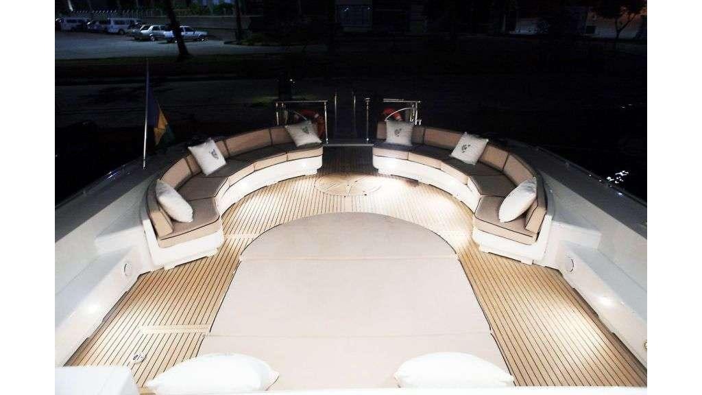 a room with a bed and a chair aboard MINA II Yacht for Charter