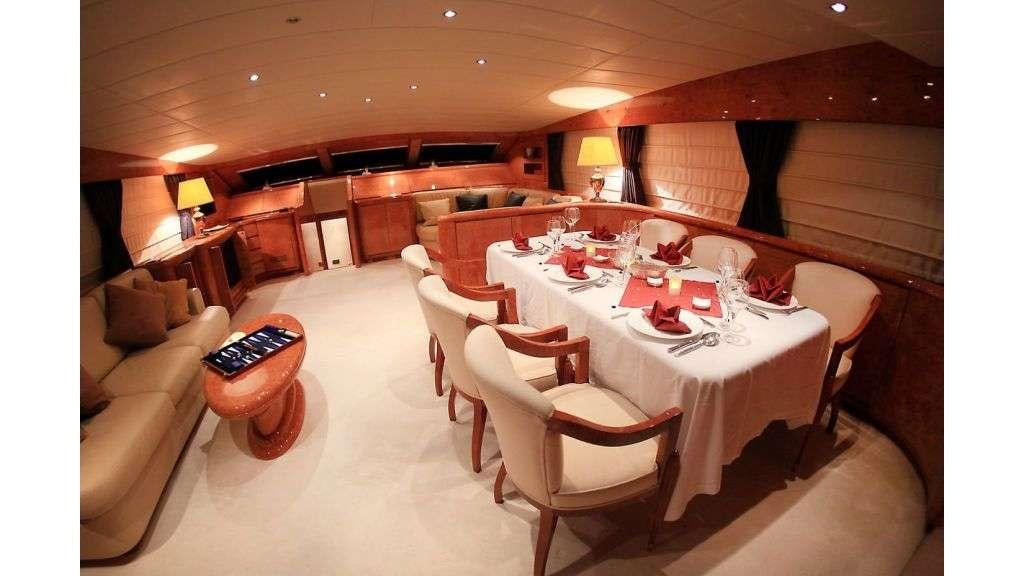 a dining room with a table and chairs aboard MINA II Yacht for Charter