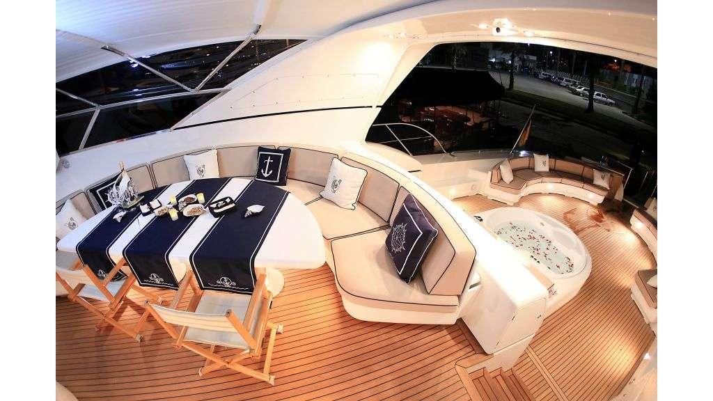 a room with a table and chairs aboard MINA II Yacht for Charter